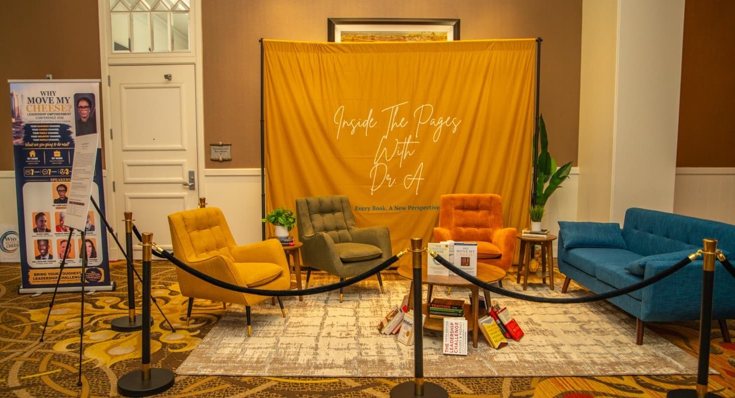 The Inside the Pages with Dr. A set: mustard backdrop and armchairs